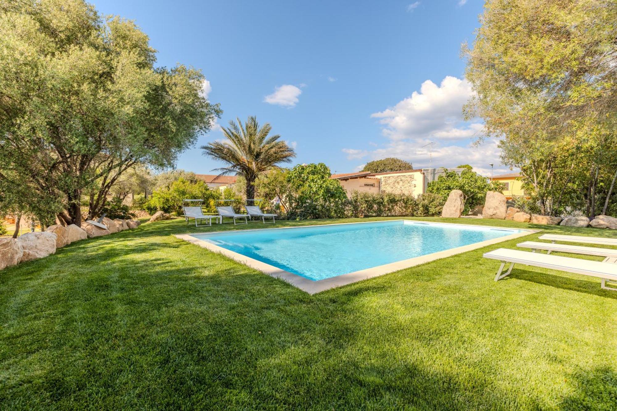 Stazzo San Teodoro Piscina Condivisa Apartment Bagian luar foto