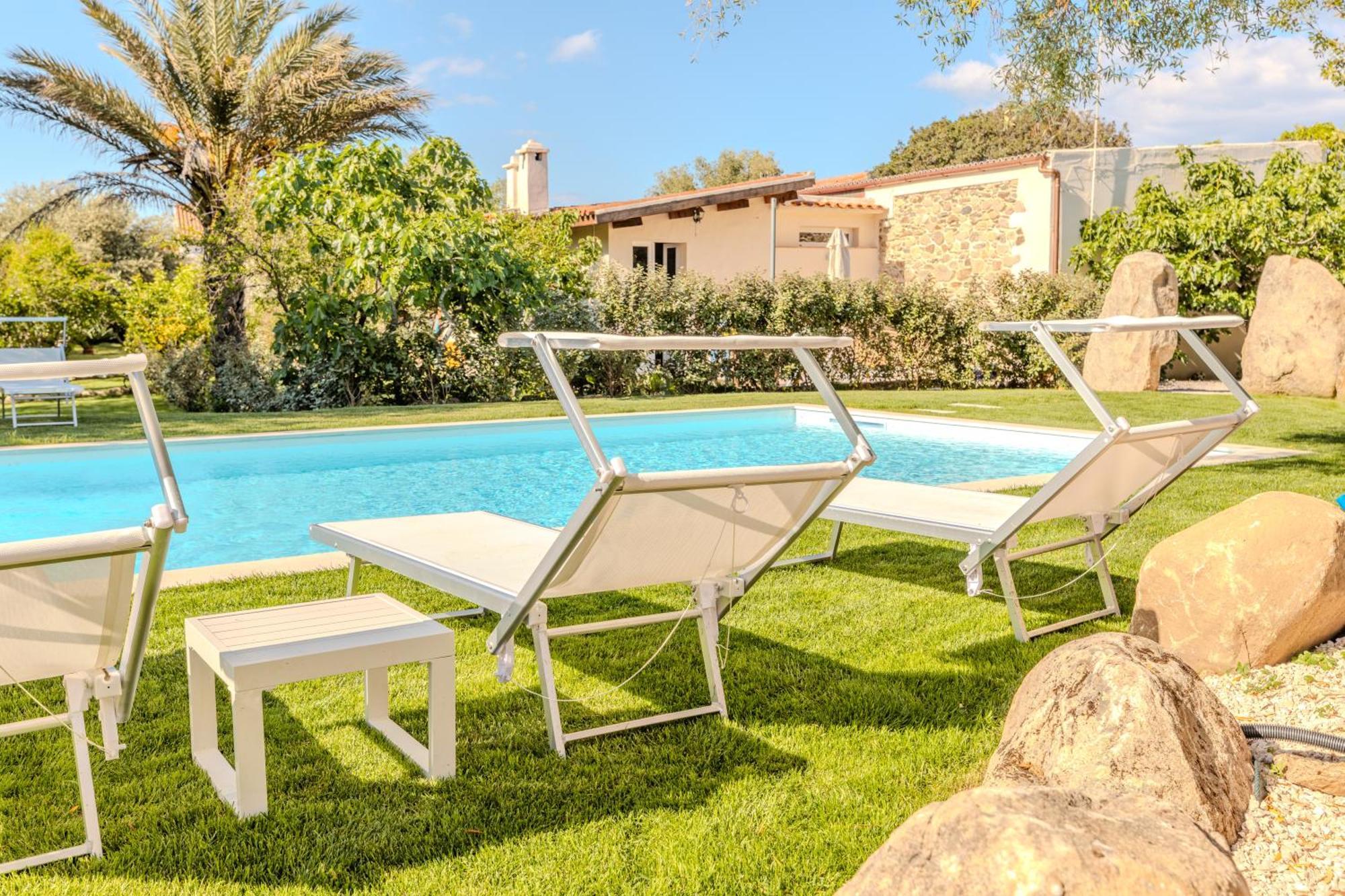 Stazzo San Teodoro Piscina Condivisa Apartment Bagian luar foto